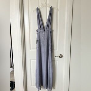 Brand new beautiful sequin dress with deep V